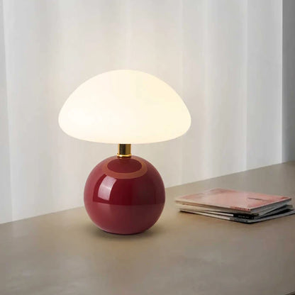 Wine red Pola ceramic table lamp on a console