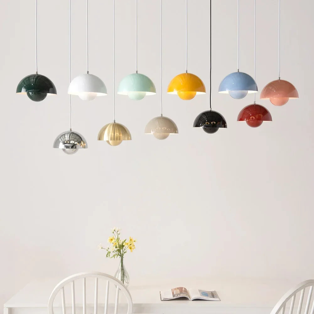 Ivory, green, and burgundy Fleur pendant lights in a dining room
