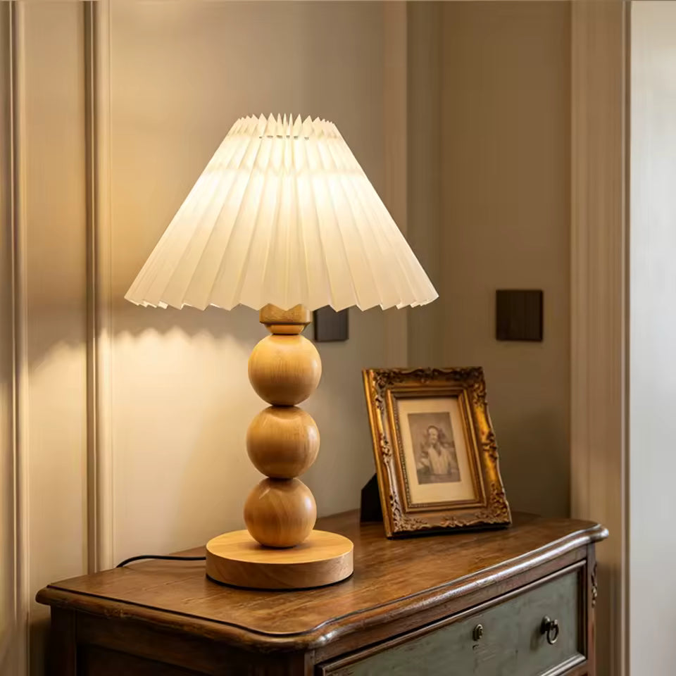 Oren pleated wood table lamp on a vintage console