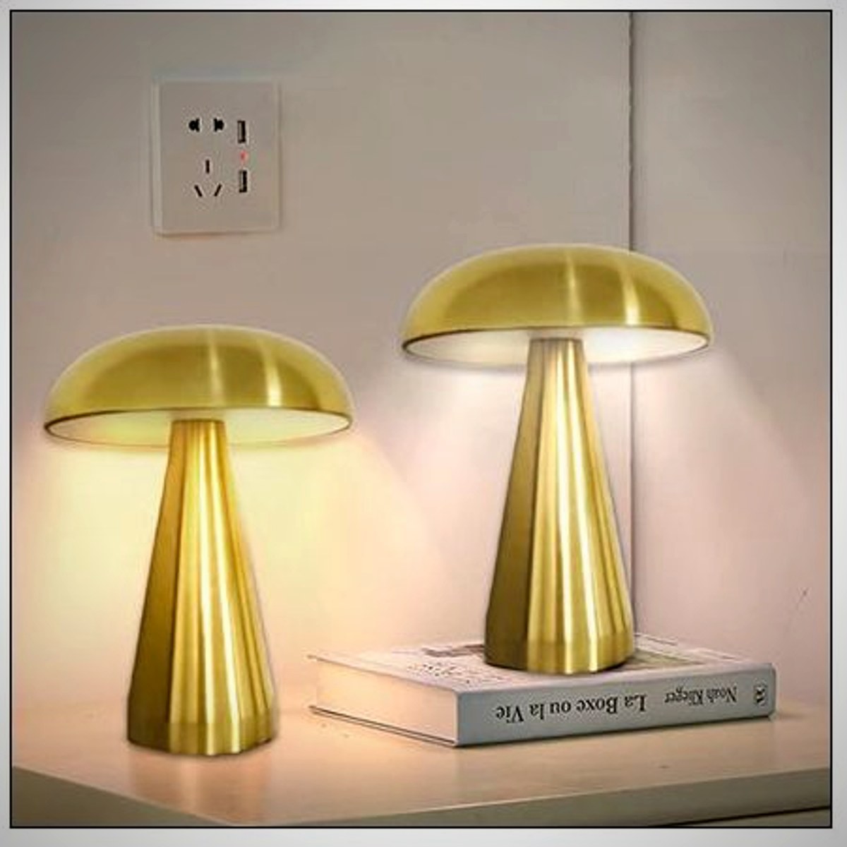 Two Juno gold mushroom lamps on a console