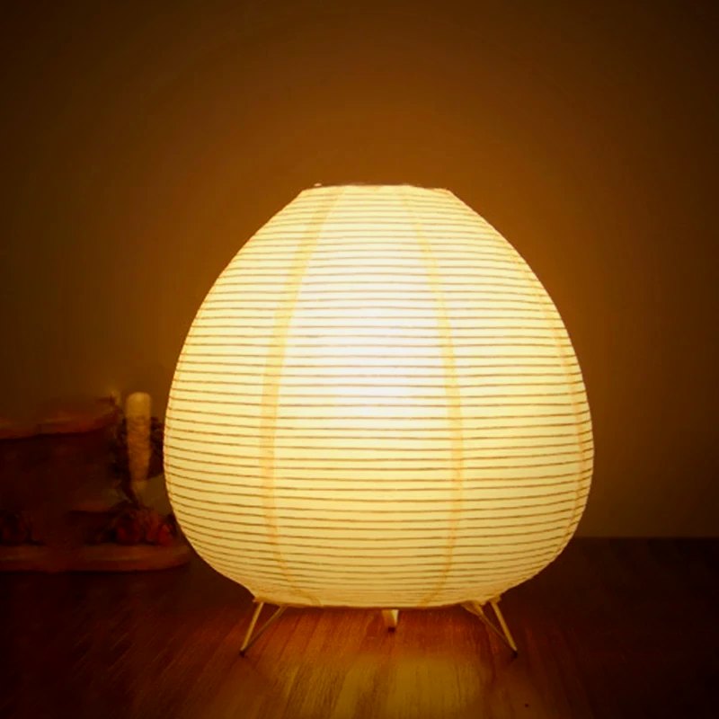 Kana lamp glowing on a wooden side table