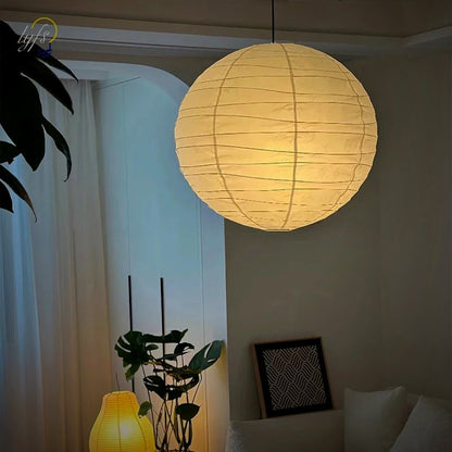 Kumo rice-paper pendant lit in a living room