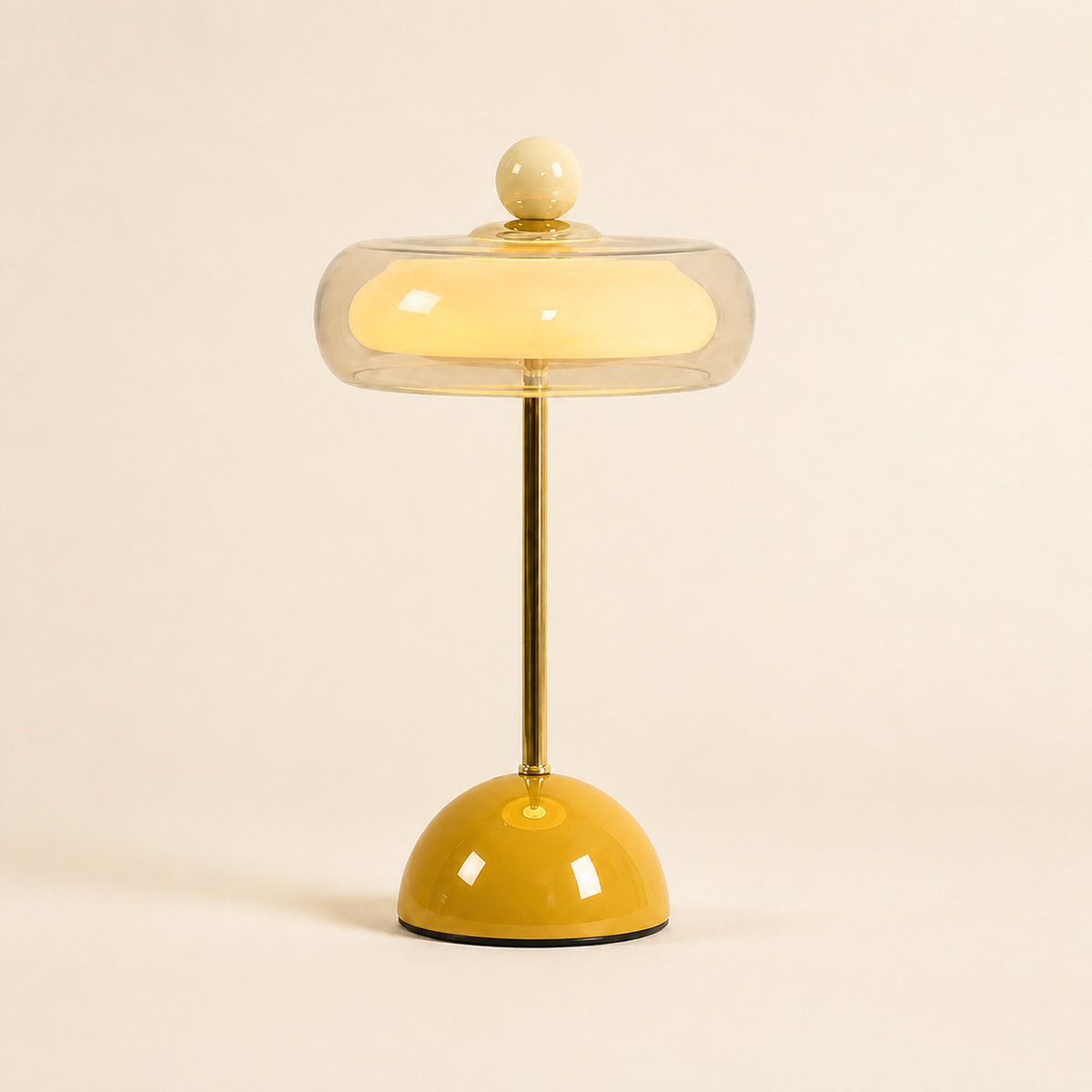 Mustard yellow Oria rechargeable glass table lamp with a clear dome shade