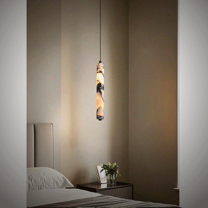 Stele stone pendant glowing above a bedside